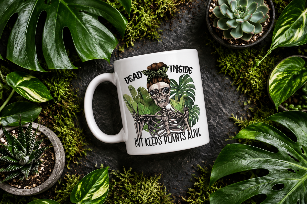 Flat lay mug surrounded by monstera and moss