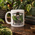 Mug on dark wood with tropical plants